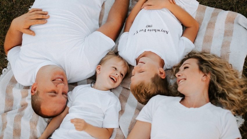 a group of people laying on top of each other
